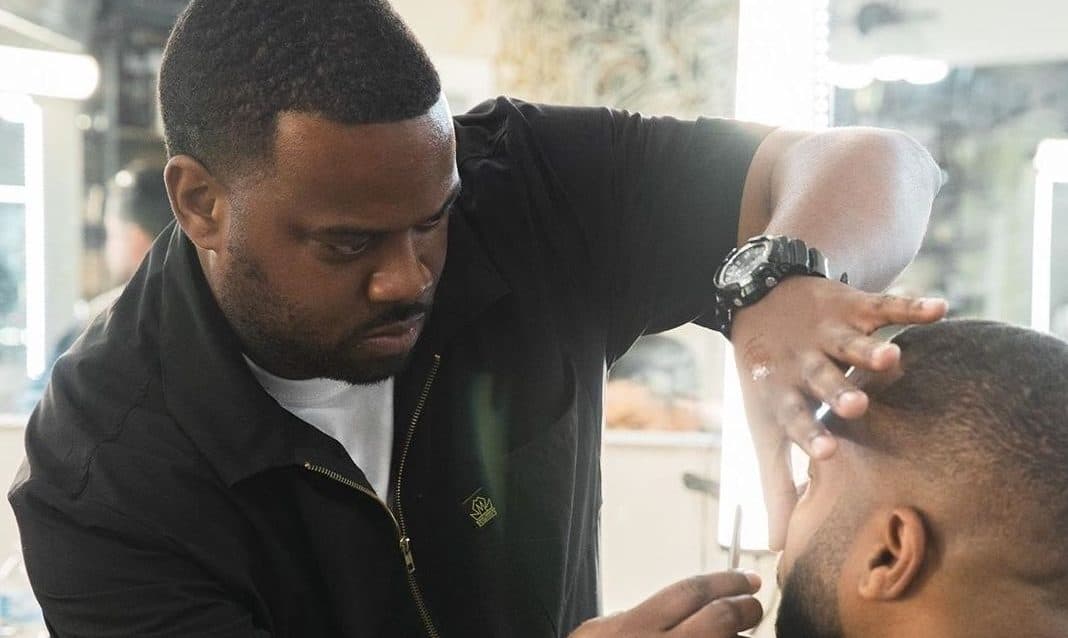 Johnnie J giving a haircut