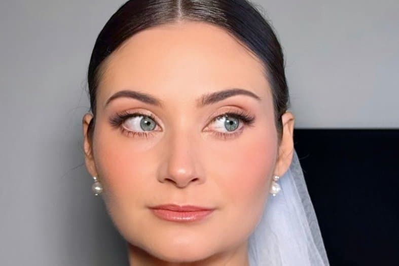 Soft glam bridal makeup by Valeria Nichols — bride with satin veil