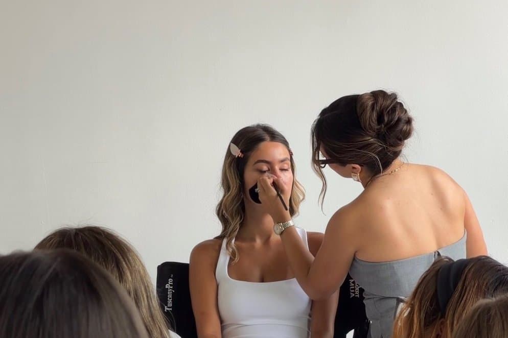 Valeria Nichols leading a live bridal makeup masterclass in Denver
