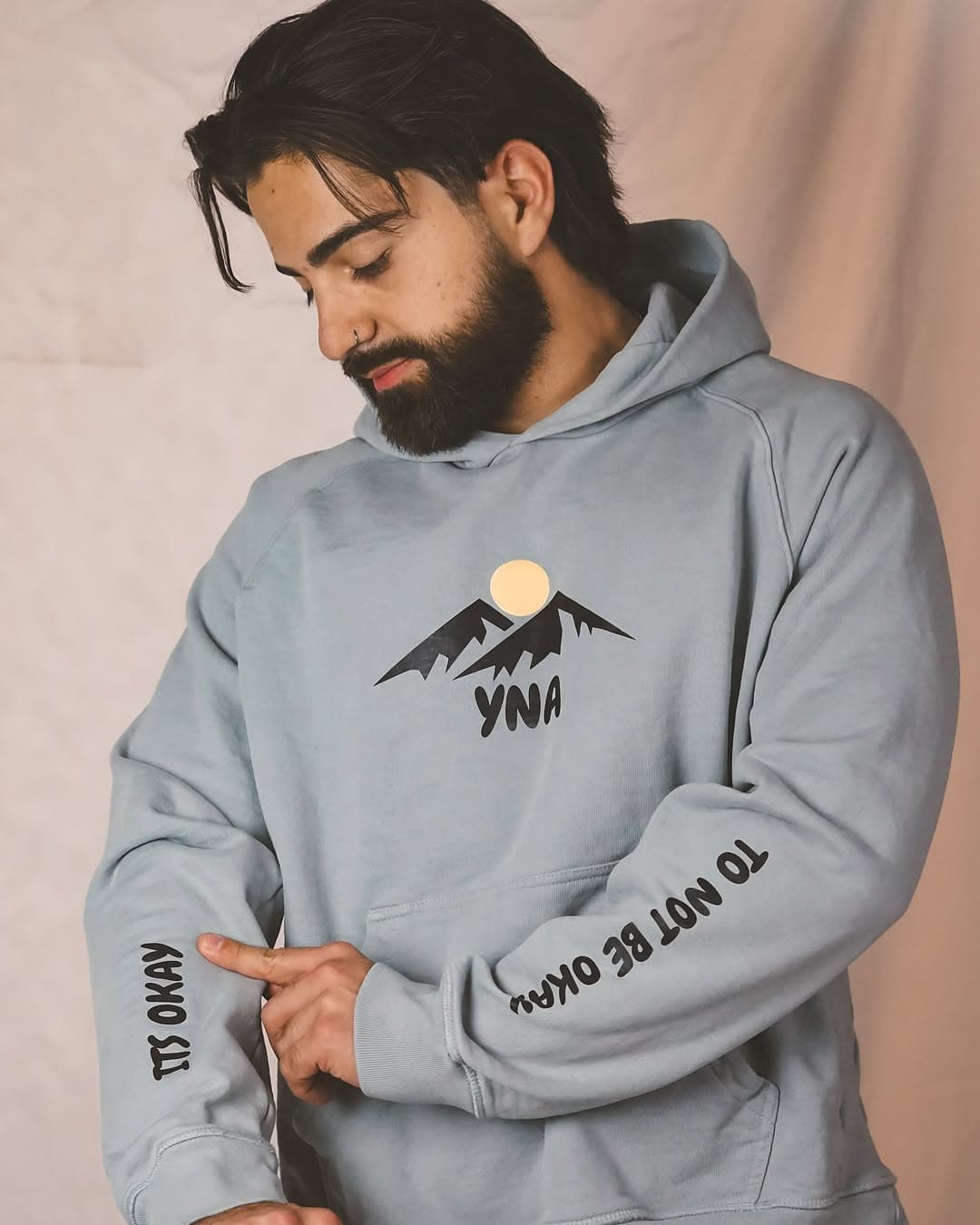 Sina Balouch, host and founder of the YNA Mental Health podcast